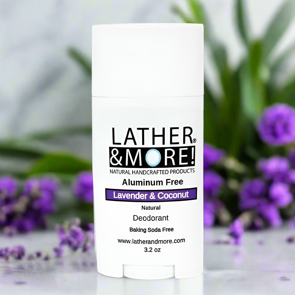 Lavender and Coconut Natural Deodorant tube on light countertop with lavender flowers in the background.
