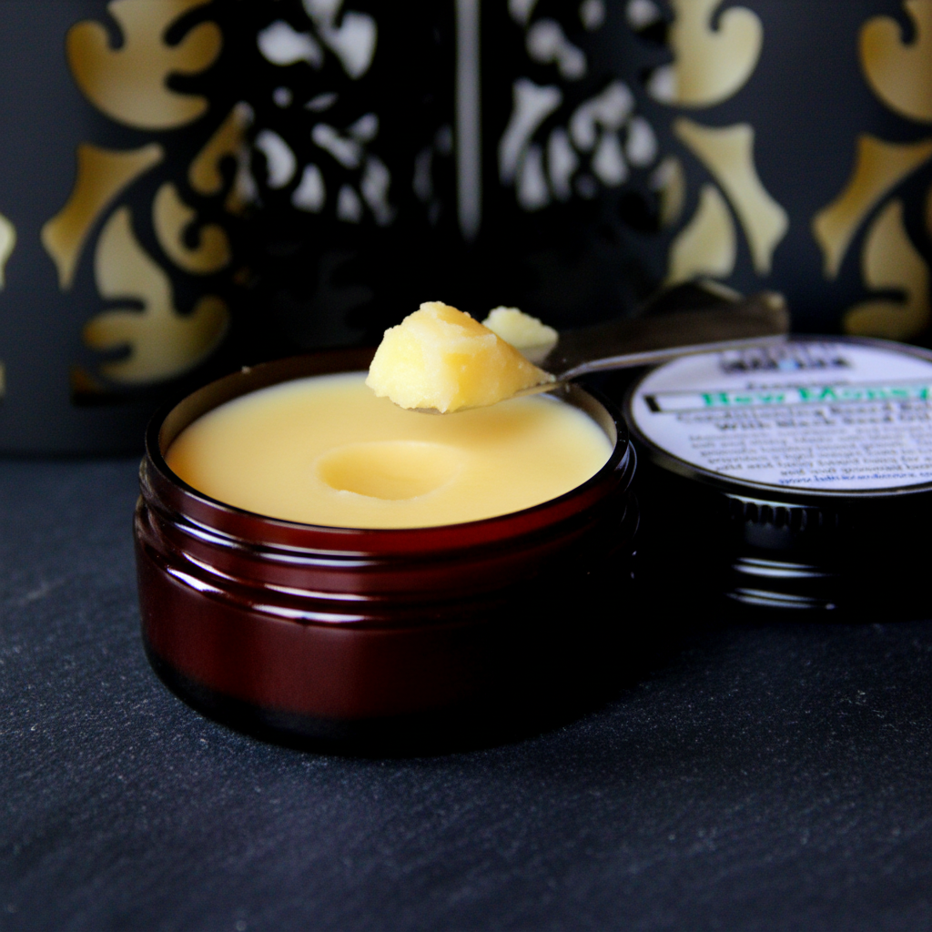 Lather and More New Money Beard Balm open tin showing golden balm texture macro shot